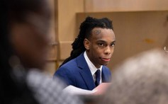 Jamell Demons, better known as YNW Melly, looks out at friends and family walking into the courtroom during his double murder trial on June 20, 2023, at Broward County Courthouse in Fort Lauderdale, Florida.