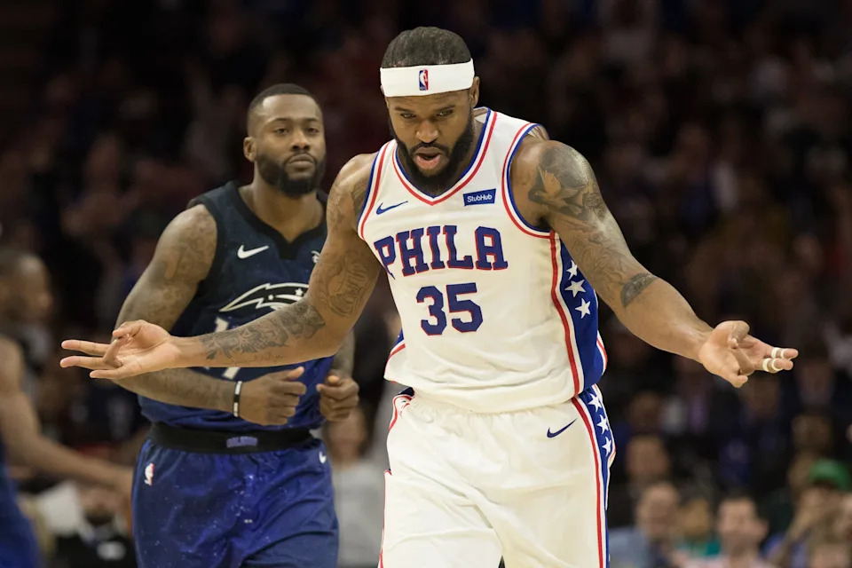 Feb 24, 2018; Philadelphia, PA, USA; Philadelphia 76ers forward Trevor Booker (35) reacts to his three pointer in front of Orlando Magic forward Jonathon Simmons (17) during the fourth quarter at Wells Fargo Center. Mandatory Credit: Bill Streicher-USA TODAY Sports