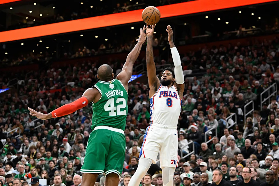 Dec 25, 2024; Boston, Massachusetts, USA; Philadelphia 76ers forward Paul George (8) shoots the ball over Boston Celtics center Al Horford (42) during the first half at TD Garden. Mandatory Credit: Eric Canha-Imagn Images