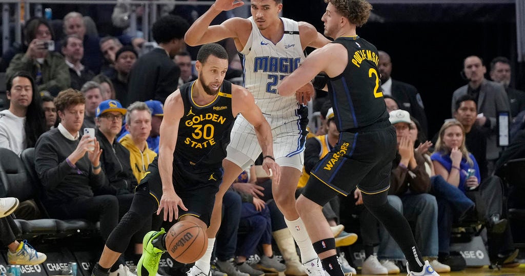 Wiggins and Curry lead Warriors in fight to hold off Magic rally