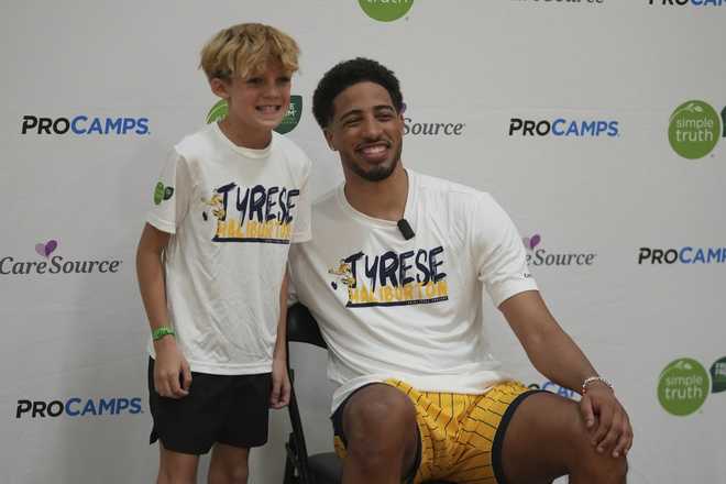 Indiana Pacers' Tyrese Haliburton poses for a photo with Broden Barkhimer during his basketball camp, Saturday, Aug. 23, 2025, in Westfield, Indiana. Indiana Pacers' Tyrese Haliburton poses for a photo with Broden Barkhimer during his basketball camp, Saturday, Aug. 23, 2025, in Westfield, Indiana.