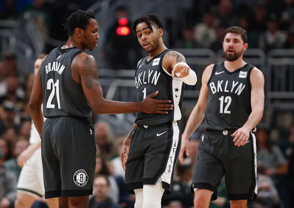 Apr 6, 2019; Milwaukee, WI, USA; Brooklyn Nets guard D'Angelo Russell (1) talks with guard Treveon Graham (21) during the first half at Wisconsin Entertainment and Sports Center. Mandatory Credit: Kamil Krzaczynski-USA TODAY Sports