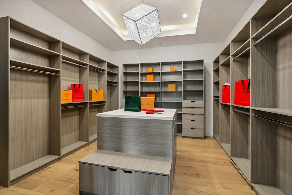 The dwelling boasts an impressive modern facade and comes complete with six bedrooms, 10 bathrooms, and a primary suite with a "boutique-style walk-in closet," the listing stated.