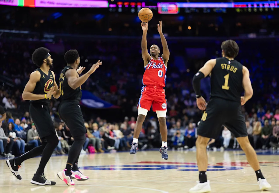 Jan 24, 2025; Philadelphia, Pennsylvania, USA; Philadelphia 76ers guard Tyrese Maxey (0) shoots a three point shot against the Cleveland Cavaliers during the first quarter at Wells Fargo Center. Mandatory Credit: Bill Streicher-Imagn Images