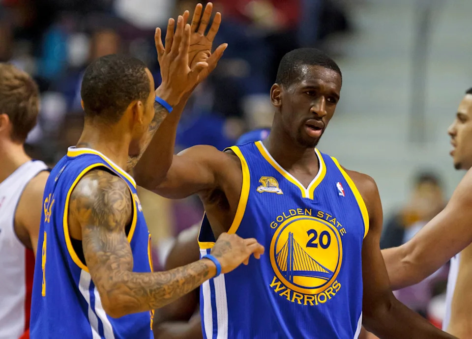 Jan. 15, 2012; Auburn Hills, MI, USA; Golden State Warriors power forward Ekpe Udoh (20) receives congratulations from shooting guard Monta Ellis (8) in the fourth quarter against the Detroit Pistons at The Palace. Mandatory Credit: Rick Osentoski-USA TODAY Sports