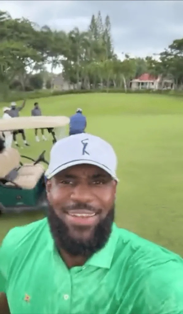 LeBron James golfs through the rain. Instagram, @KingJames