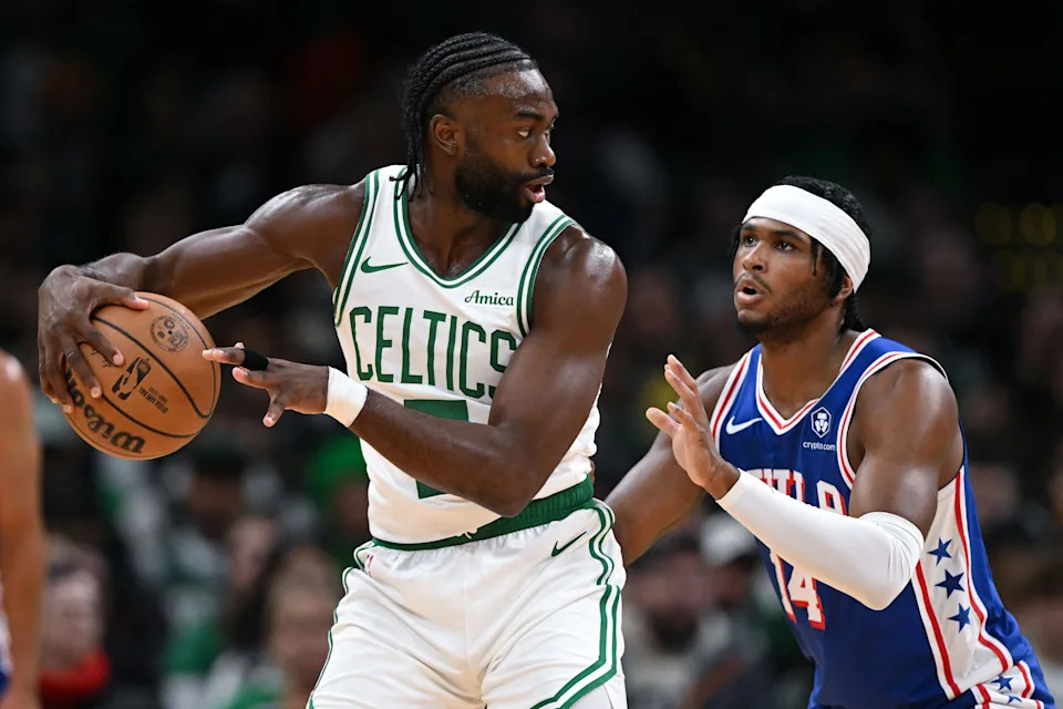 Oct 12, 2024; Boston, Massachusetts, USA; Boston Celtics guard Jaylen Brown (7) controls the ball against Philadelphia 76ers guard Ricky Council IV (14) during the first half at the TD Garden. Mandatory Credit: Brian Fluharty-Imagn Images