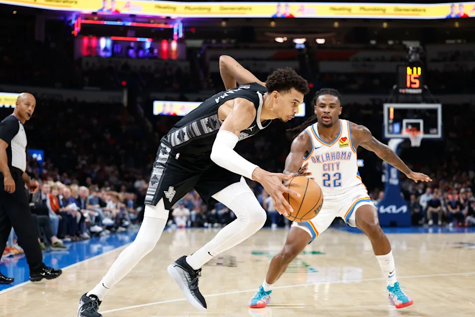 Oct 30, 2024; Oklahoma City, Oklahoma, USA; San Antonio Spurs center Victor Wembanyama (1) drives to the basket beside Oklahoma City Thunder guard Cason Wallace (22) during the second quarter at Paycom Center. Mandatory Credit: Alonzo Adams-Imagn Images