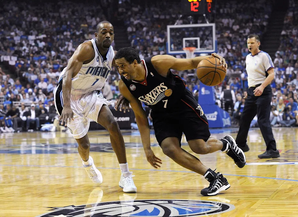 ORLANDO, FL - APRIL 22: Andre Miller #7 of the Philadelphia 76ers drives against Rafer Alston #1 of the Orlando Magic in Game Two of the Eastern Conference Quarterfinals during the 2009 NBA Playoffs at Amway Arena April 22, 2009 in Orlando, Florida. NOTE TO USER: User expressly acknowledges and agrees that, by downloading and/or using this Photograph, user is consenting to the terms and conditions of the Getty Images License Agreement. (Photo by Sam Greenwood/Getty Images)