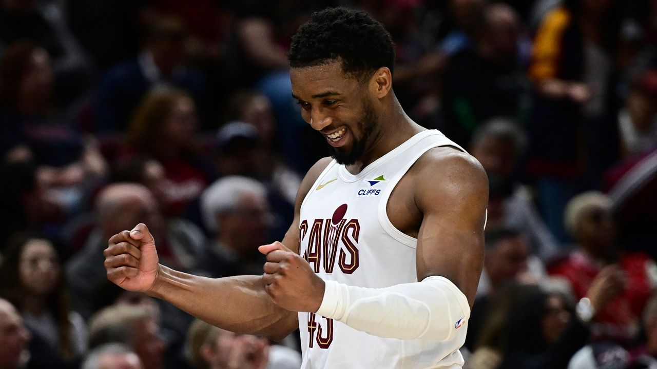 Cleveland Cavaliers guard Donovan Mitchell reacts while walking to the bench in the second half of an NBA basketball game against the Los Angeles Clippers, Sunday, March 30, 2025, in Cleveland.