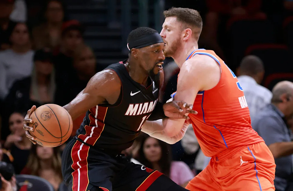 Dec 20, 2024; Miami, Florida, USA; Oklahoma City Thunder center Isaiah Hartenstein (55) defends Miami Heat center Bam Adebayo (13) during the first half at Kaseya Center. Mandatory Credit: Rhona Wise-Imagn Images
