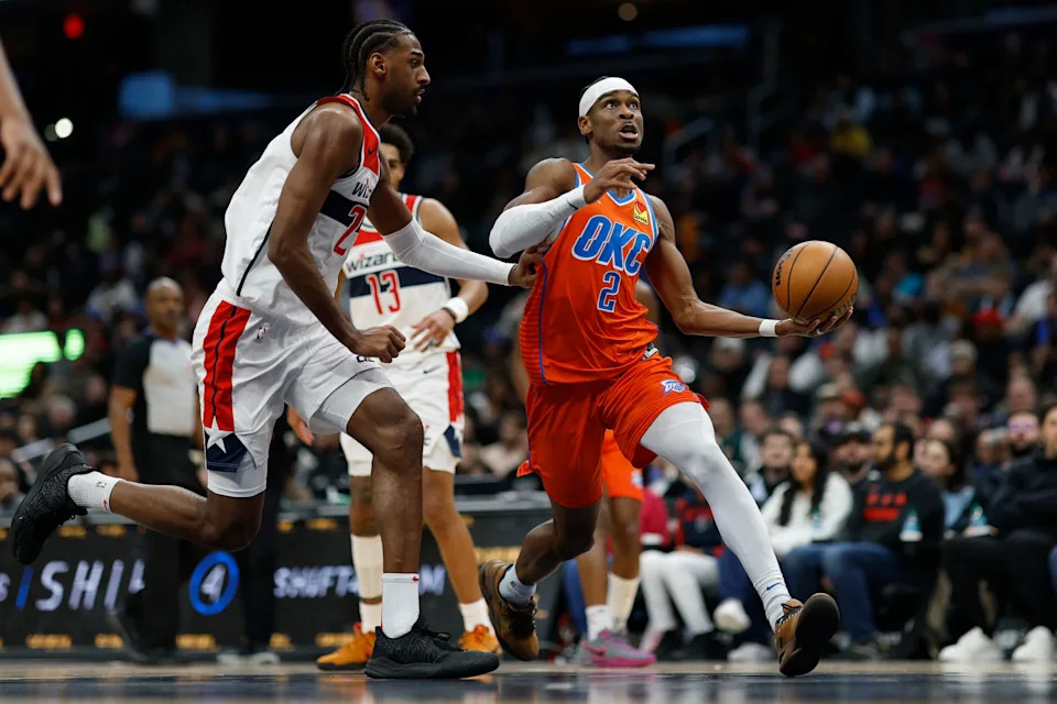 Jan 12, 2025; Washington, District of Columbia, USA; Oklahoma City Thunder guard Shai Gilgeous-Alexander (2) drives to the basket as Washington Wizards forward Alexandre Sarr (20)Êdefends in the third quarter at Capital One Arena. Mandatory Credit: Geoff Burke-Imagn Images