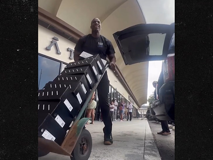 081825_anthony_edwards_kids_pile_primary