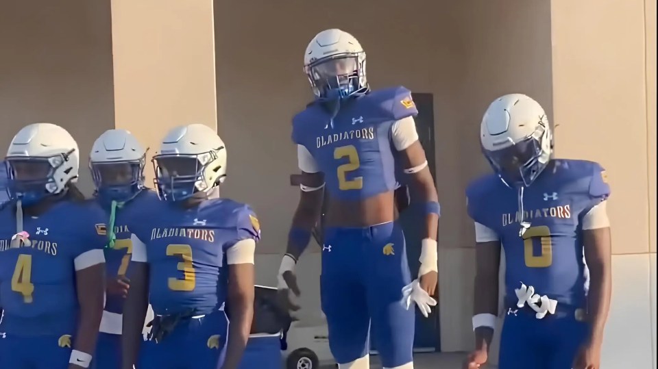 The high school football and basketball star was seen towering over his teammates