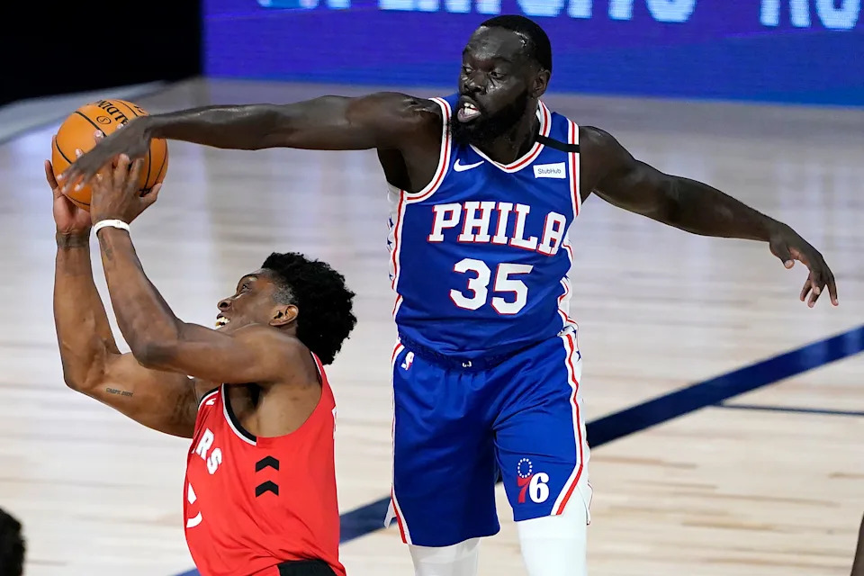 Aug 12, 2020; Lake Buena Vista, Florida, USA; Toronto Raptors' Stanley Johnson, left, tries to shoot as Philadelphia 76ers' Marial Shayok (35) defends during the second half of an NBA basketball game Wednesday, Aug. 12, 2020 in Lake Buena Vista, Fla. Mandatory Credit: Ashley Landis/Pool Photo-USA TODAY Sports