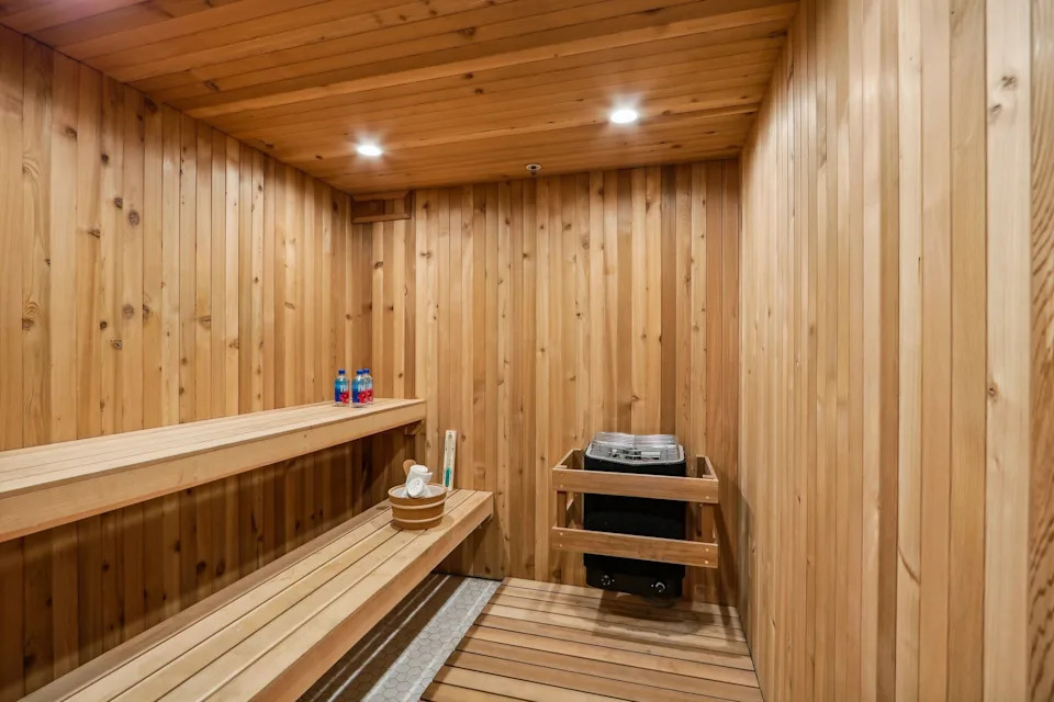 It comes with several amenities, including a sauna, a gym, a home theater, full bar, library, and even a panic room complete with a vaulted door.