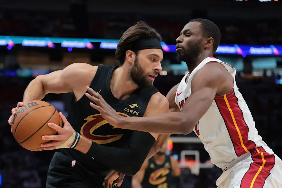Cleveland Cavaliers guard Max Strus (1) protects the basketball from Miami Heat forward Andrew Wiggins (22) during Game 3 of a first-round playoff series April 26, 2025, in Miami, Florida.