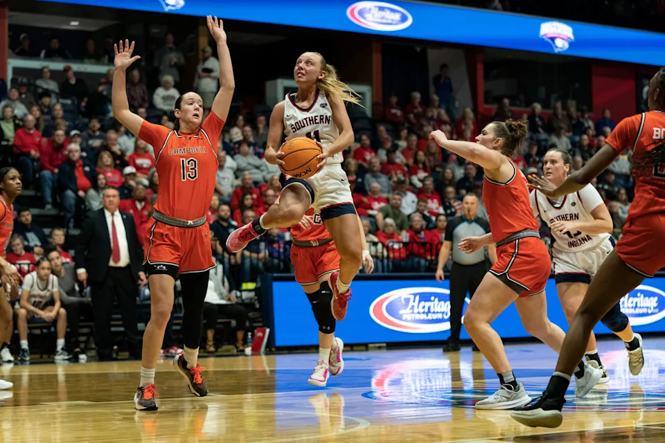 Southern Indiana's Ali Saunders (11) takes a shot as the University of Southern Indiana Screaming Eagles play the Campbell University Fighting Camels in the second round of the WNIT at Liberty Arena in Evansville, Ind., Sunday, March 23, 2025.