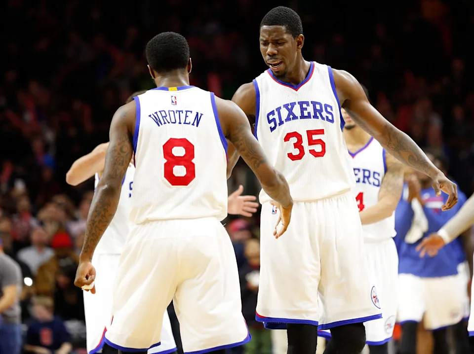 Jan 5, 2015; Philadelphia, PA, USA; Philadelphia 76ers center Henry Sims (35) and guard Tony Wroten (8) react after a score against the Cleveland Cavaliers during the second half at Wells Fargo Center. The 76ers defeated the Cavaliers 95-92. Mandatory Credit: Bill Streicher-USA TODAY Sports