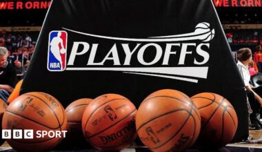 A logo of the NBA play-offs with multiple basketballs in shot at the bottom of the picture