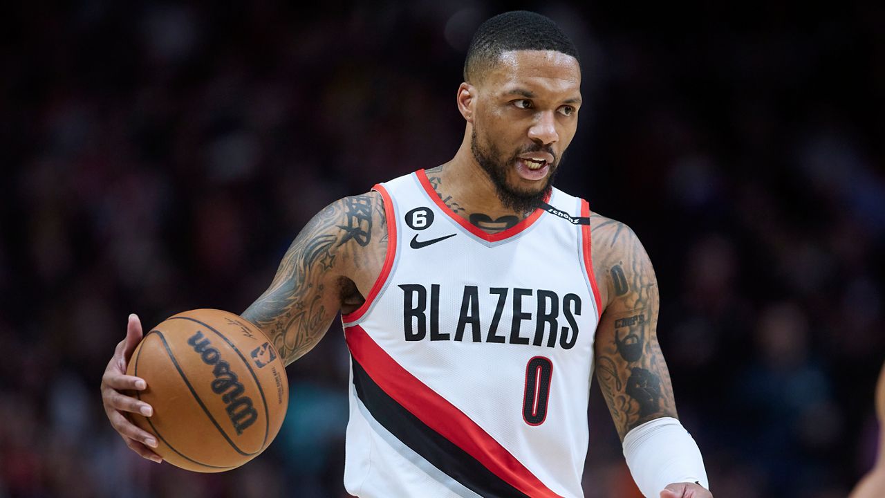 Milwaukee Bucks guard Damian Lillard (0) gestures after a three-point basket against the Indiana Pacers during the second half of a first-round NBA basketball playoff game in Indianapolis, Tuesday, April 22, 2025.