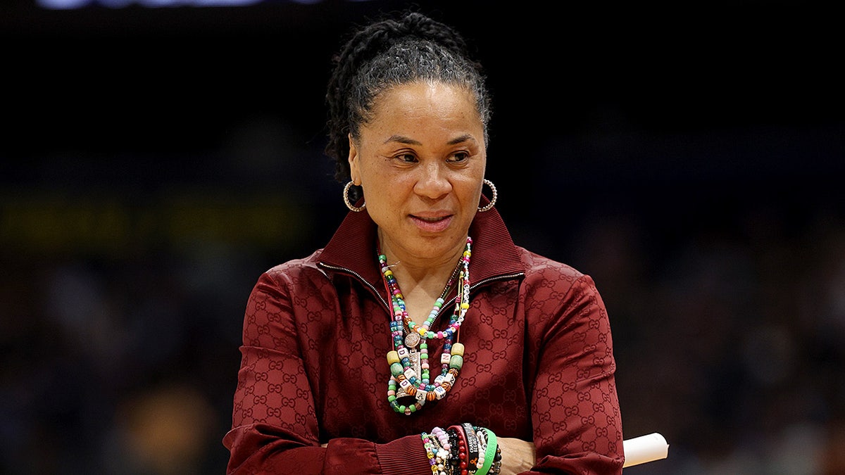 Dawn Staley looks on