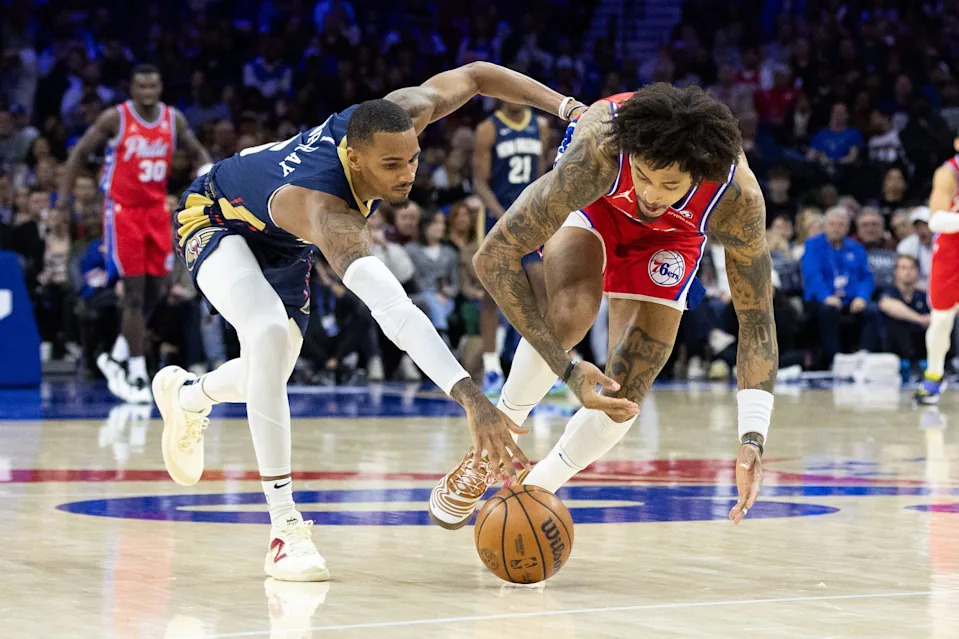 Jan 10, 2025; Philadelphia, Pennsylvania, USA; Philadelphia 76ers guard Kelly Oubre Jr. (9) and New Orleans Pelicans guard Dejounte Murray (5) compete for a loose ball during the second quarter at Wells Fargo Center. Mandatory Credit: Bill Streicher-Imagn Images