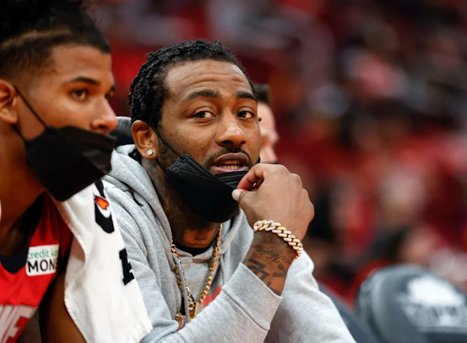 HOUSTON, TEXAS - OCTOBER 22: John Wall #1 of the Houston Rockets sits on the bench during the game against the Oklahoma City Thunder at Toyota Center on October 22, 2021 in Houston, Texas. (Photo by Tim Warner/Getty Images)