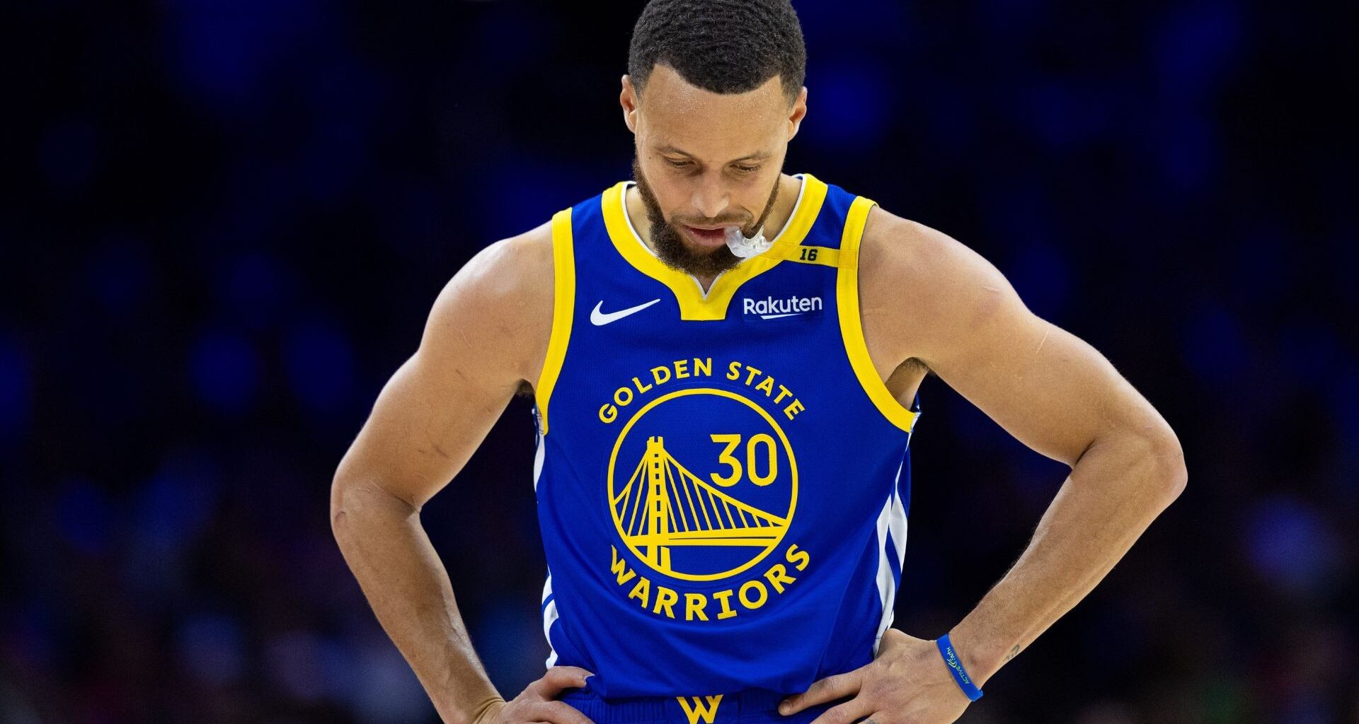 Draymond Green (L), Paige Bueckers (R)