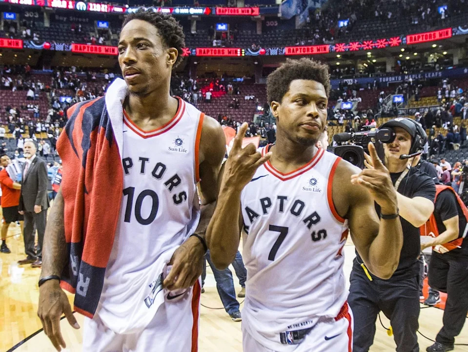Toronto Raptors DeMar DeRozan (left) and Kyle Lowry leave the court following a win against the Washington Wizards in 2018.