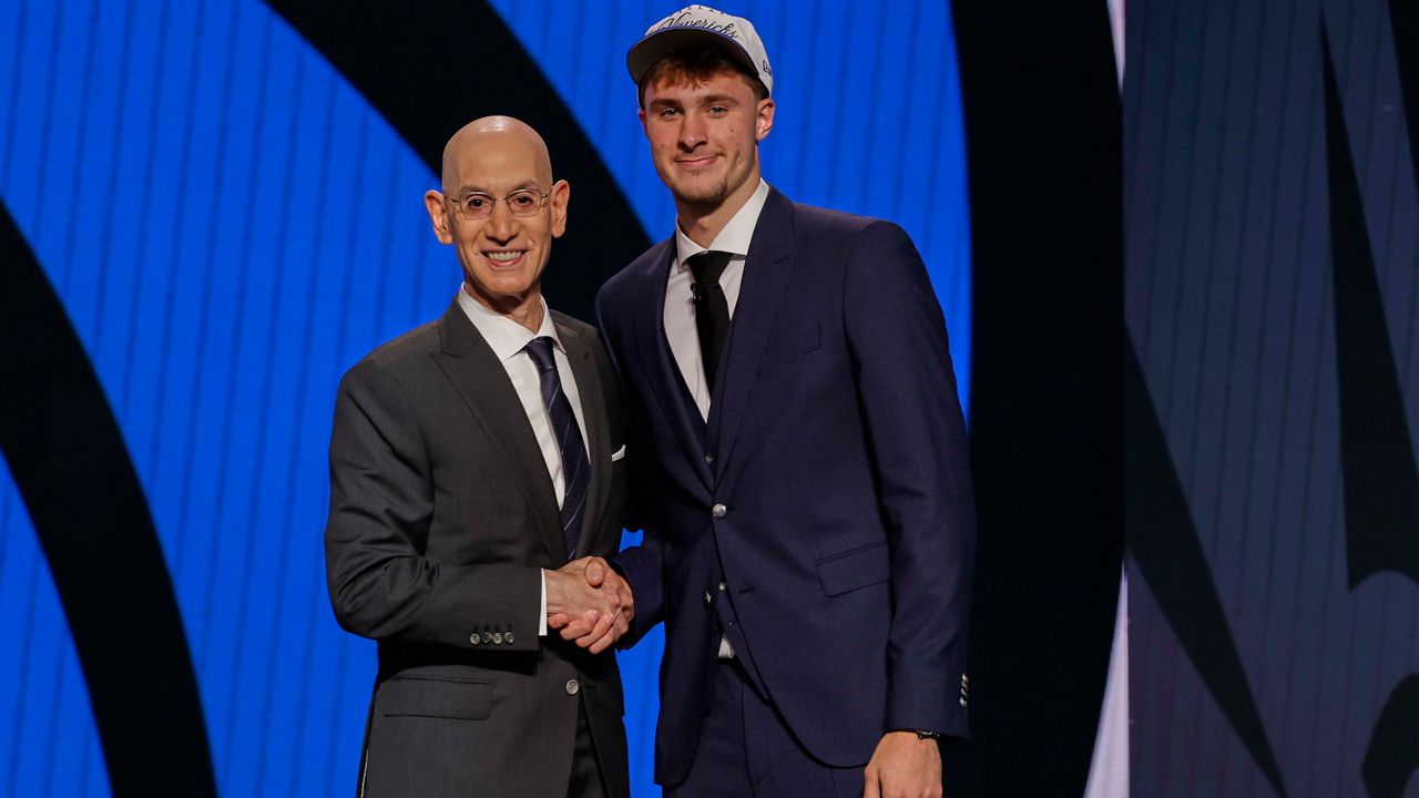 Cooper Flagg (right) poses for a photo with NBA Commissioner Adam Silver after being selected No. 1 overall by the Dallas Mavericks In the first round of the NBA Draft on Wednesday, June 25, 2025, in New York. Flagg played for Montverde Academy in Lake County, then at Duke University, before entering the draft. (AP Photo/Adam Hunger)