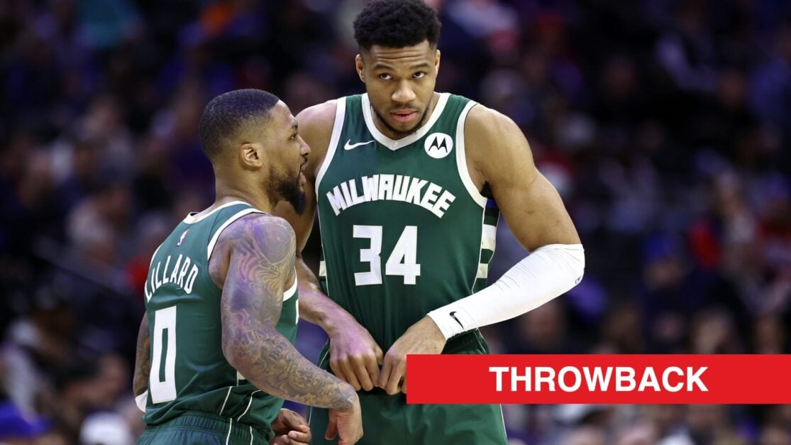 Damian Lillard #0 and Giannis Antetokounmpo #34 of the Milwaukee Bucks speak during the first quarter against the Philadelphia 76ers.