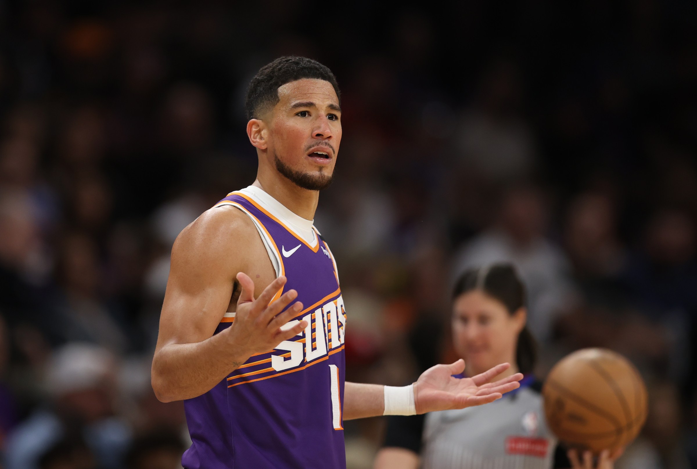 PHOENIX, ARIZONA - MARCH 24: Devin Booker #1 of the Phoenix Suns reacts during the first half against the Milwaukee Bucks at PHX Arena on March 24, 2025 in Phoenix, Arizona. NOTE TO USER: User expressly acknowledges and agrees that, by downloading and or using this photograph, User is consenting to the terms and conditions of the Getty Images License Agreement. (Photo by Jeremy Chen/Getty Images)
