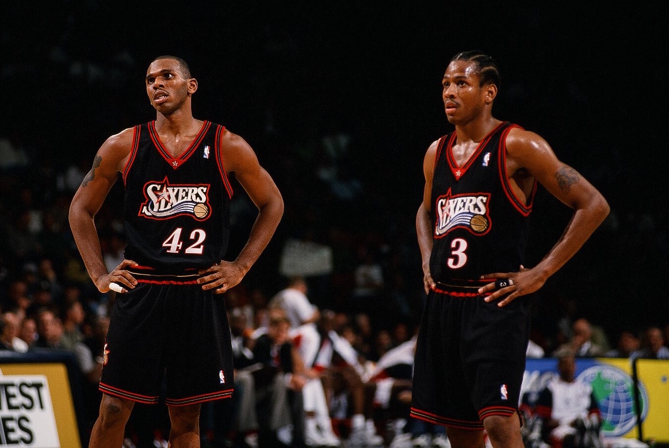 HOUSTON, TX - NOVEMBER 12: Jerry Stackhouse #42 and Allen Iverson #3 of the Philadelphia 76ers stand on the court during the game against the Houston Rockets on November 12, 1997 at the Compaq Center in Houston, Texas. The 76ers won 114-100. (Photo by Sporting News via Getty Images via Getty Images)