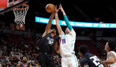 Sacramento Kings' Dylan Cardwell, left, and Charlotte Hornets' Ryan Kalkbrenner battle for a rebound during an NBA Summer League championship basketball game Sunday, July 20, 2025, in Las Vegas. (AP Photo/John Locher)