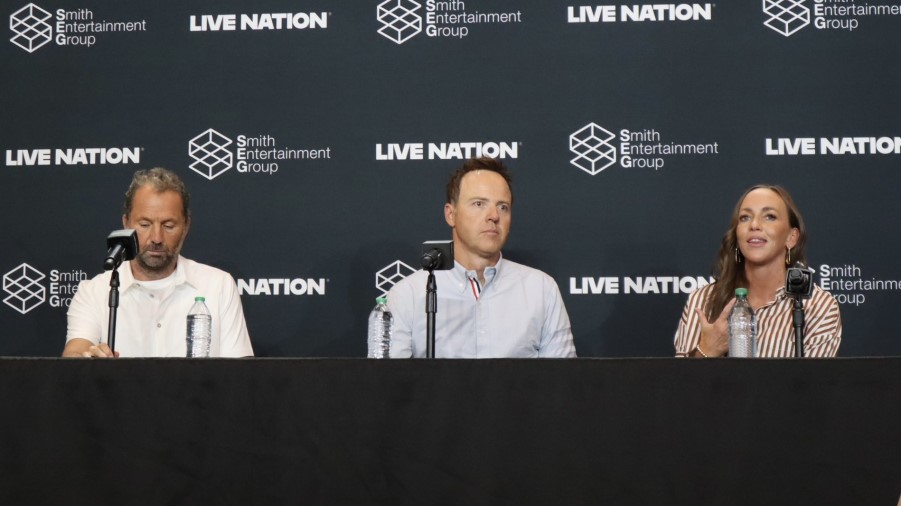 Michael Rapino, CEO of and President of Live Nation (left), Ryan Smith (center), chairman of SEG, a...