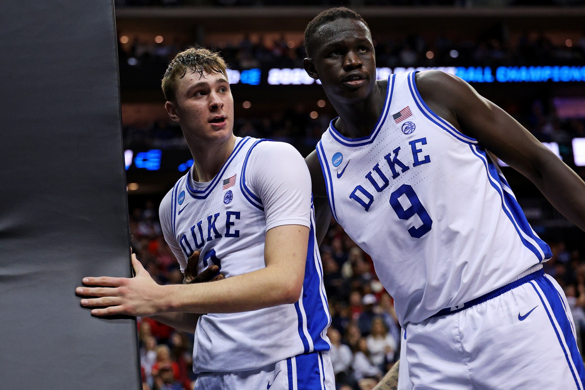 Mar 27, 2025; Newark, NJ, USA; Duke Blue Devils forward Cooper Flagg (2) reacts with center Khaman Maluach (9) during the second half against the Arizona Wildcats during an East Regional semifinal of the 2025 NCAA tournament at Prudential Center. Mandatory Credit: Vincent Carchietta-Imagn Images