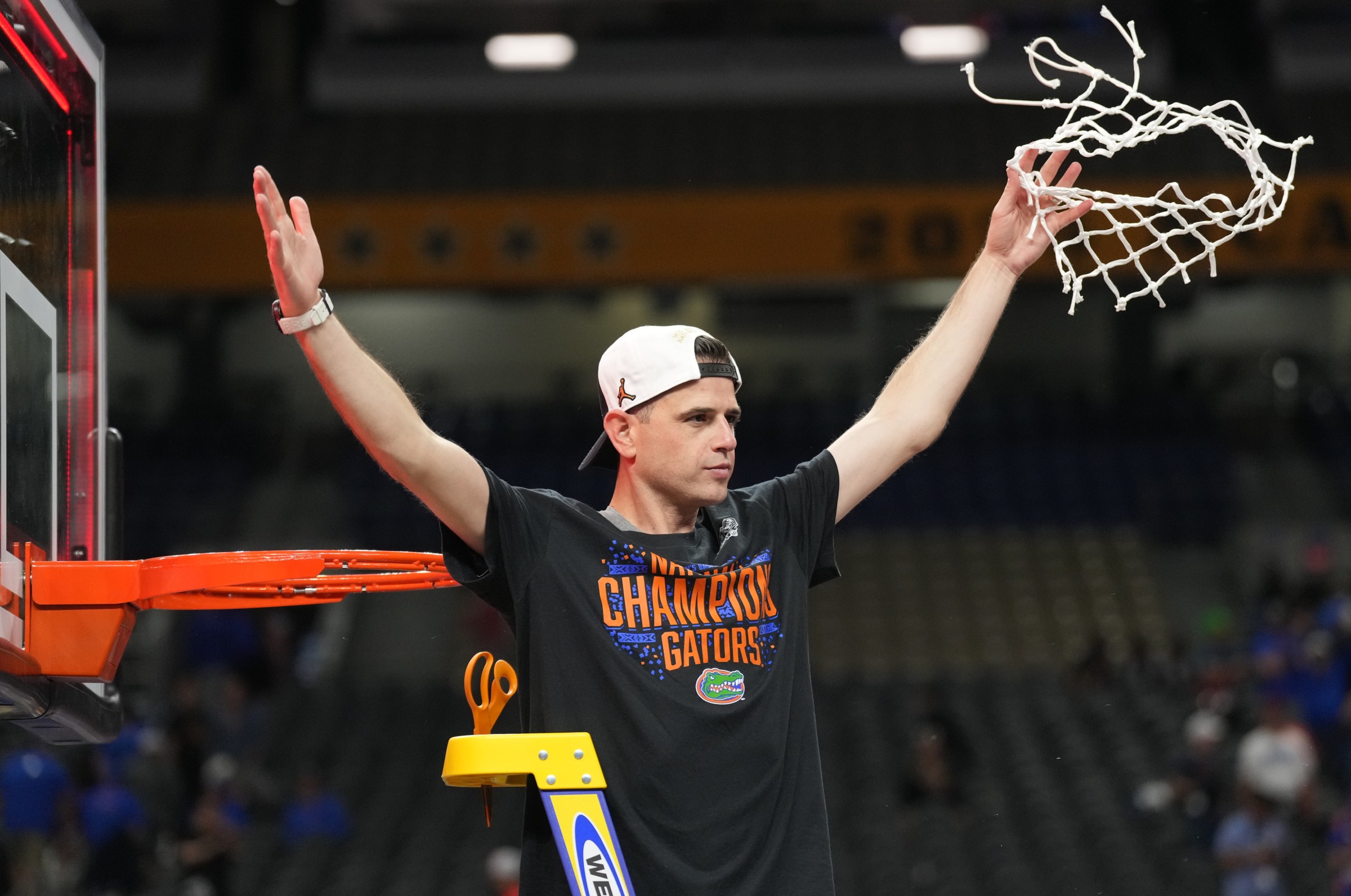 Apr 7, 2025; San Antonio, TX, USA; Florida Gators head coach Todd Golden cuts down the net after defeating the Houston Cougars in the national championship game of the Final Four of the 2025 NCAA Tournament at the Alamodome. Mandatory Credit: Robert Deutsch-Imagn Images