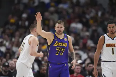 Los Angeles Lakers guard Luka Doncic (77) dribbling the basketball during the second half of an NBA game against the Denver Nuggets on February 22, 2025 in Denver, Colorado.  