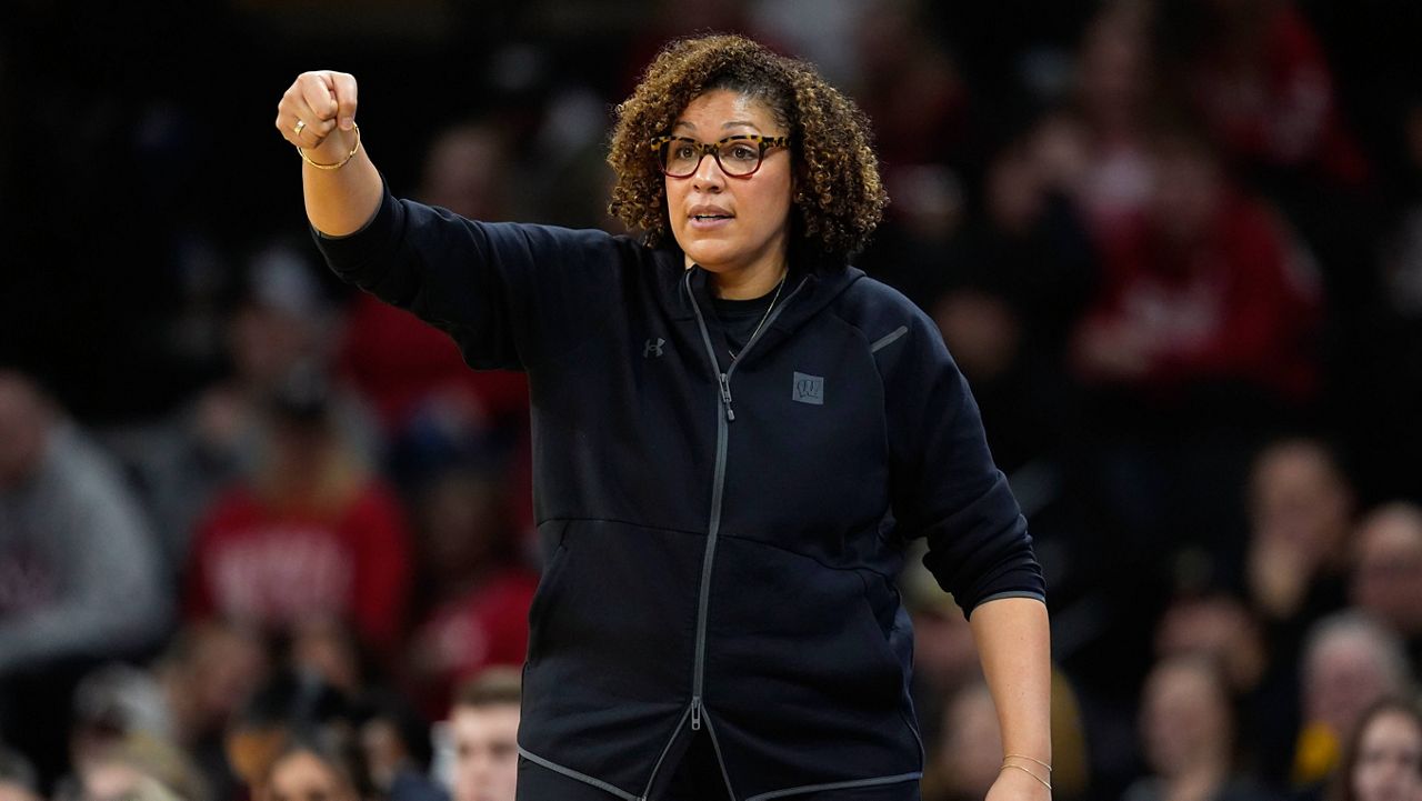 Wisconsin head coach Marisa Moseley directs her team during the first half of an NCAA college basketball game against Iowa, Jan. 16, 2024, in Iowa City, Iowa.