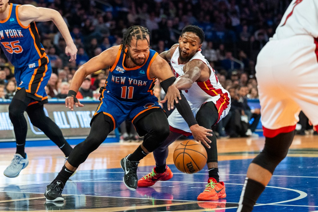Jalen Brunson and Haywood Highsmith vying for the basketball.