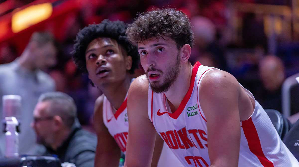 Houston Rockets center Alperen Sengun (28) and forward Amen Thompson (1) sit on the sidelines on a play stoppage against the Detroit Pistons during the in the first half at Little Caesars Arena.