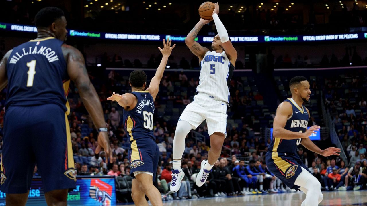 Magic forward Paolo Banchero, pictured soaring high for a shot against the Pelicans last season, and his teammates have high expectations for the 2025-26 season. (AP Photo/Matthew Hinton)