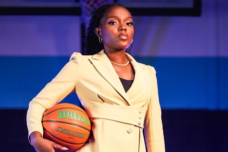 woman in a suit holding a basketball