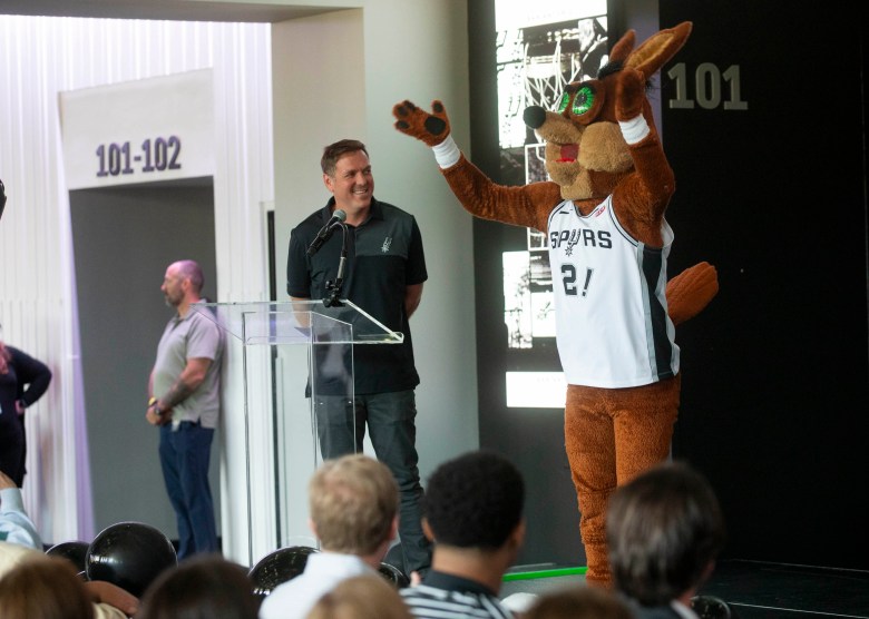 Peter Holt Jr. and the Coyote celebrate as the Frost Bank Center is announced.