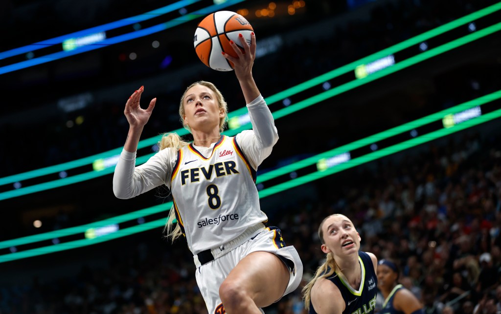 Indiana Fever's Sophie Cunningham #8 shooting a basketball.