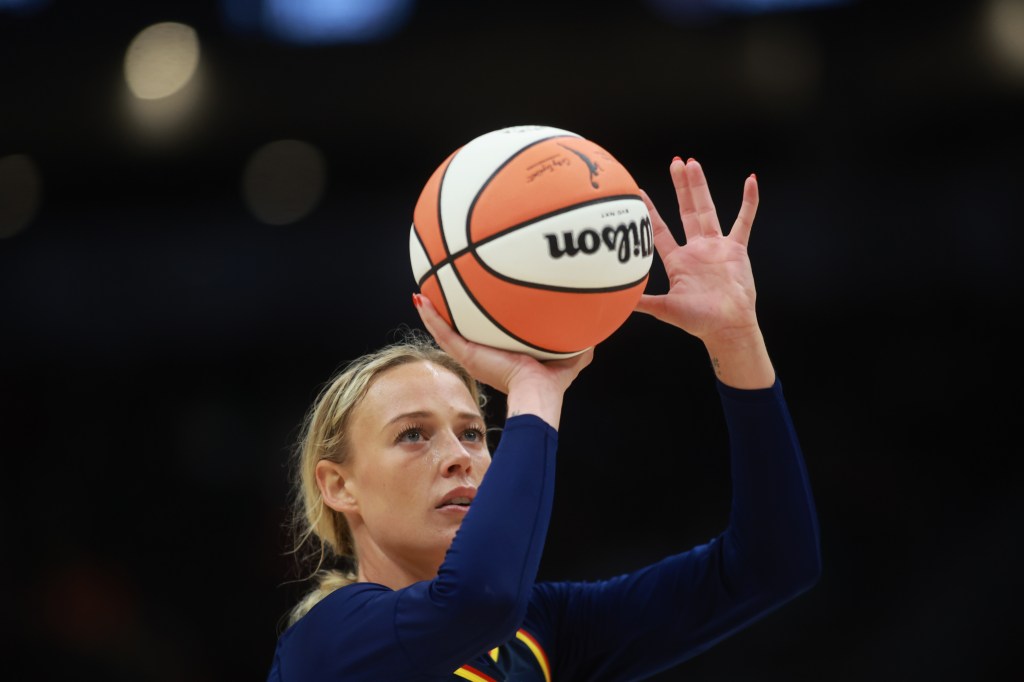 Indiana Fever player shooting a basketball.