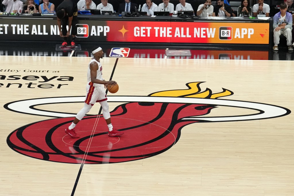 Bam Adebayo of the Miami Heat dribbling the ball on the court.