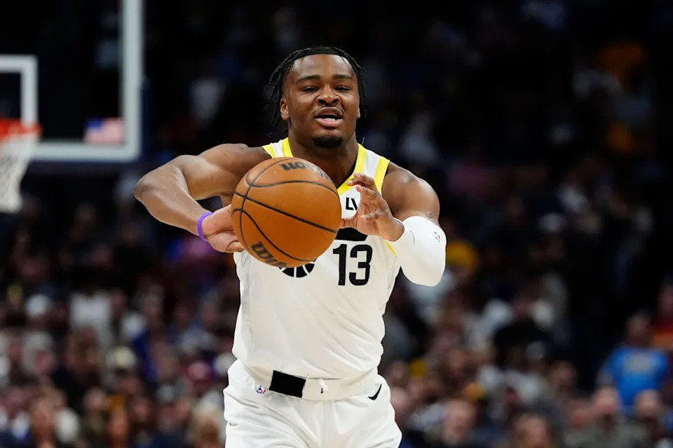 Mar 28, 2025; Denver, Colorado, USA; Utah Jazz guard Isaiah Collier (13) passes the ball in the first quarter against the Denver Nuggets at Ball Arena. Mandatory Credit: Ron Chenoy-Imagn Images