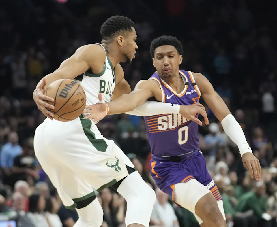 Milwaukee Bucks forward Giannis Antetokounmpo (34) is defended by Phoenix Suns forward Ryan Dunn (0) during the first quarter at PHX Arena on March 24, 2025.